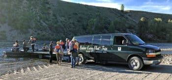 A family boarding their Barker-Ewing Scenic Float Trip in Grand Teton National Park